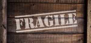 The word fragile written on a wooden crate.